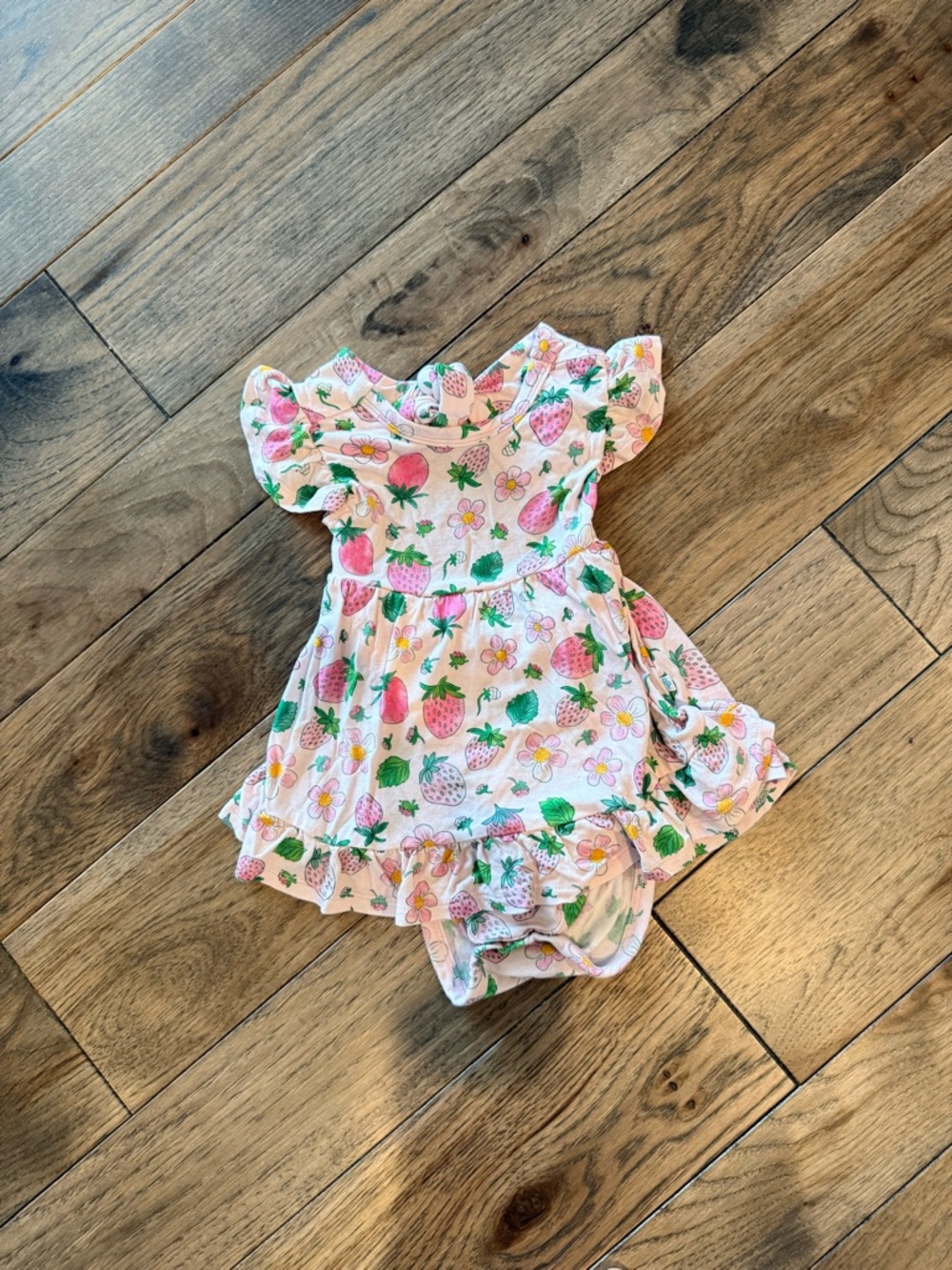 Posh Peanut Kyra strawberry print cutout skirted bodysuit